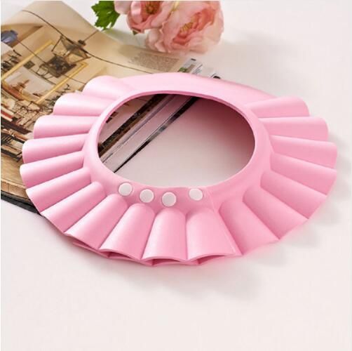 Pink Adjustable Kids Shower Cap for Bath Time Kids Shower Cap – Adjustable Baby Bath & Shampoo Hat in pink with ruffled design for protecting kids during bath time.